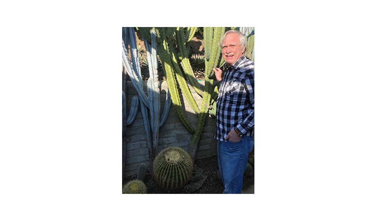 Park Nobel standing next to some cactus plants