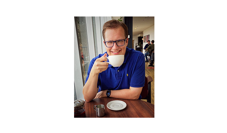 Stephen Follows drinking a cup of tea