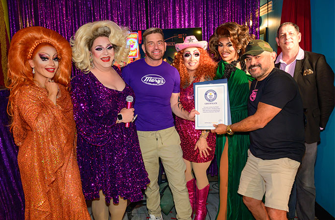 Drag queens and the owners of Hamburger Mary's West Hollywood holding their official GWR certificate with GWR's drag consultant Joe E Jeffreys